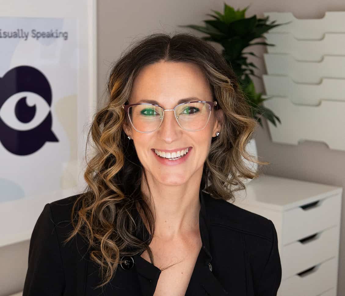 Portrait of Melissa Choquette smiling in a workspace, with Visually Speaking branding visible in the background.