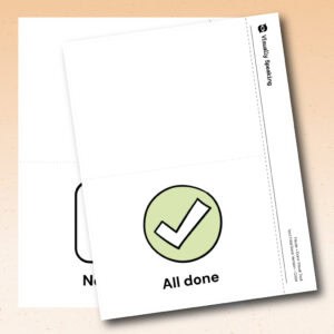 Product preview for the Pause + Done visual support tool showing layered tent card versions in portrait format. A color “All done” tent card with a green checkmark symbol appears in front of a black-and-white “Not done” version partially visible underneath. The bottom half of the front card shows a circle with a checkmark and the label “All done.”
